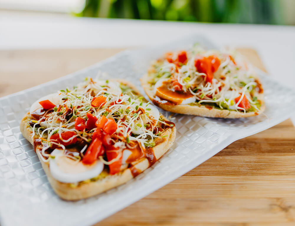 Smashed Avocado, Sprouts, Boiled Egg, Peppers, Hot Sauce Drizzle