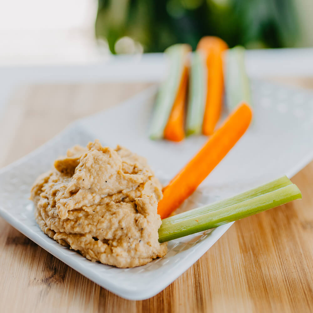 Homemade Hummus Served with Celery & Carrot Sticks