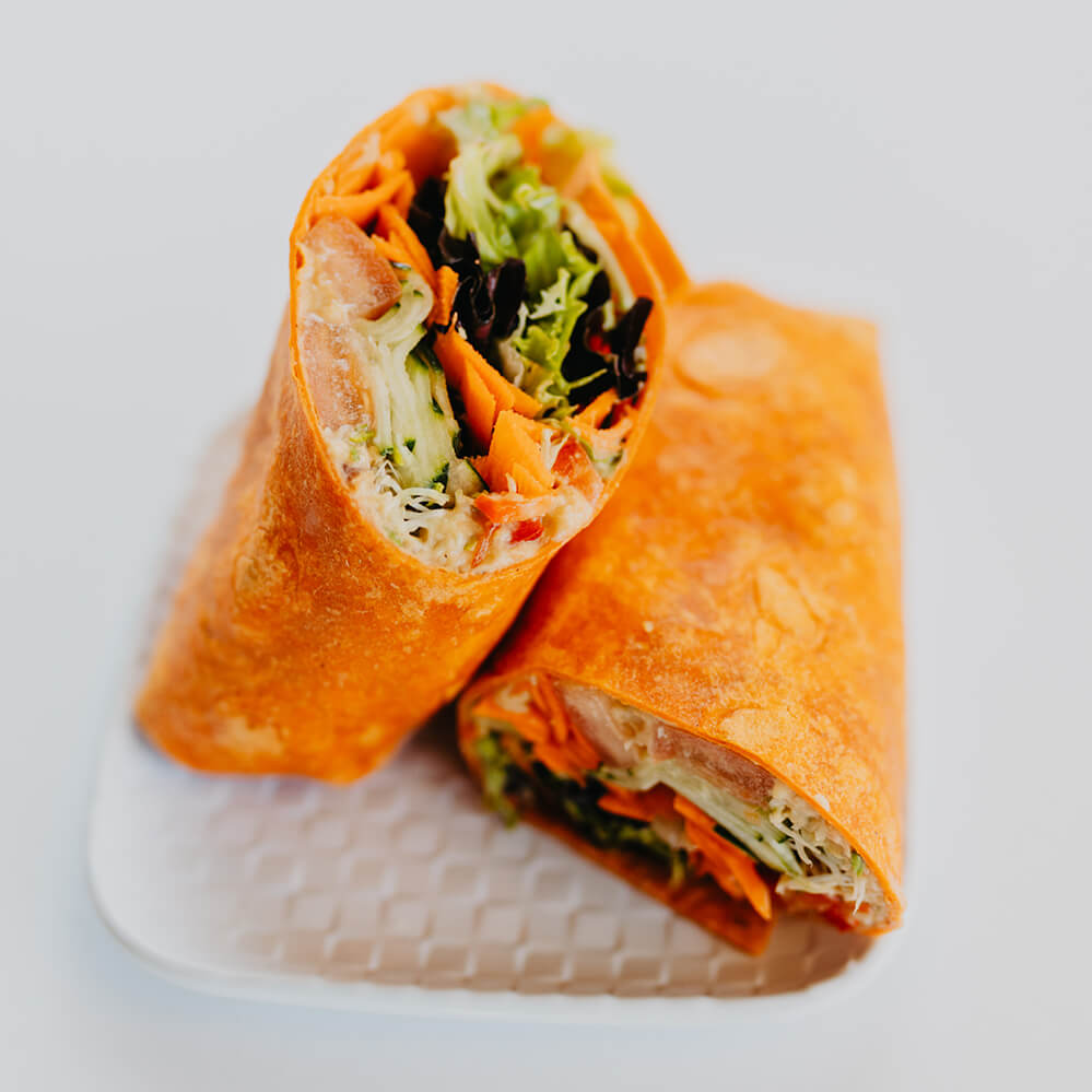 Spring Day Wrap - Hummus, Heirloom Tomatoes, Cucumbers, Sprouts, Carrots,Red Peppers, and Mixed Greens on Your Choice Of Wrap