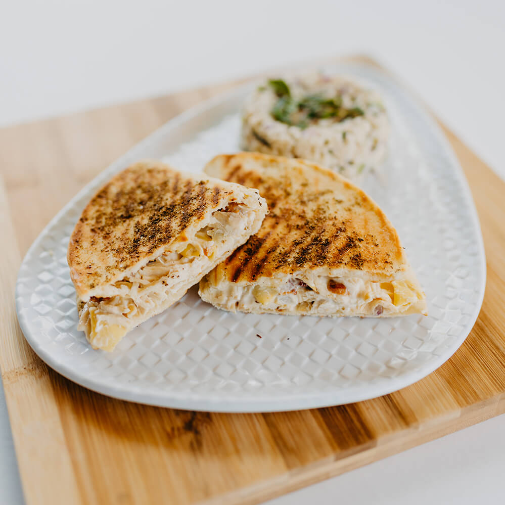 Chicken & Bacon Panini - Chicken, Bacon, Onions, Artichokes With An Aeoli in Naan Bread Grilled to Perfection
