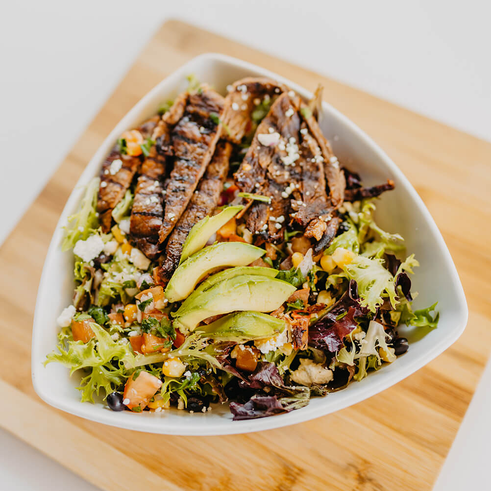 Spring Mix, Black Beans, Corn, Pico De Gallo, Feta Cheese, Fresh Home-Made Guacamole, and Salsa-Ranch Dressing with Steak