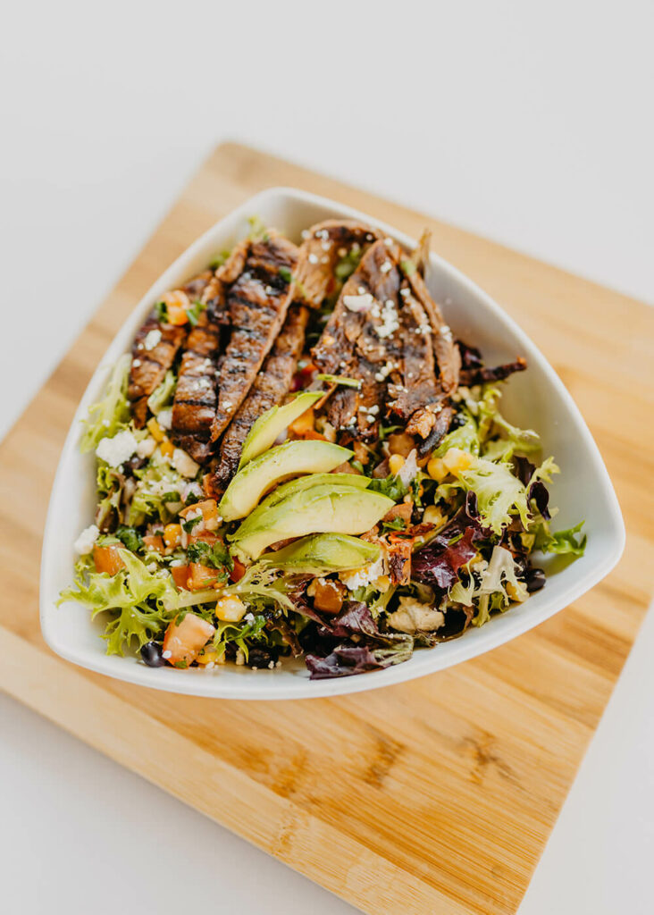 Spring Mix, Black Beans, Corn, Pico De Gallo, Feta Cheese, Fresh Home-Made Guacamole, and Salsa-Ranch Dressing with Steak